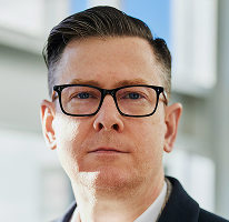 Alexander Hughes, CEO spoločnosti zameranej na obchodovanie s kryptomenami, portrét.